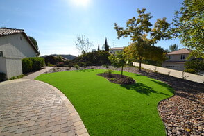 after photo of artificial grass installation in a lawn
