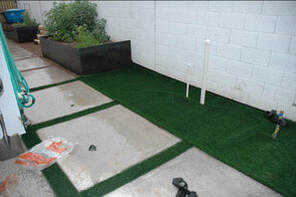 neatly installed artificial grass in a backyard