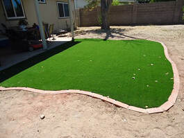 neatly installed frontyard artificial grass